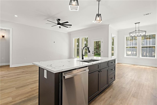 kitchen featuring open floor plan, decorative light fixtures, visible vents, dishwasher, and a sink