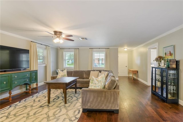 living area featuring crown molding, dark wood finished floors, ceiling fan, and baseboards