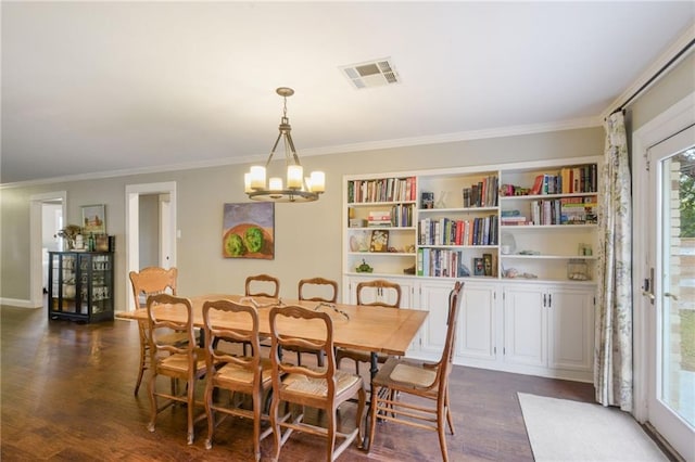 dining room featuring a chandelier, plenty of natural light, dark wood-type flooring, and crown molding