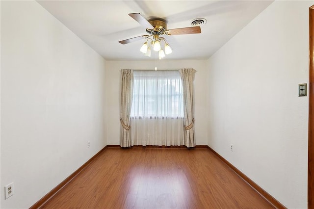 1017 Elmeer Ave, Metairie, LA 70005 - unfurnished room with ceiling fan, wood finished floors, and baseboards