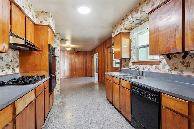 1017 Elmeer Ave, Metairie, LA 70005 - kitchen featuring black appliances, wallpapered walls, under cabinet range hood, a sink, and brown cabinets