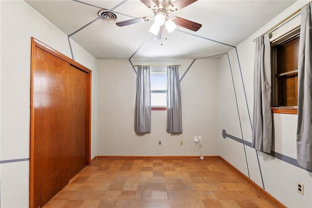 1017 Elmeer Ave, Metairie, LA 70005 - unfurnished bedroom with baseboards, a closet, and a ceiling fan