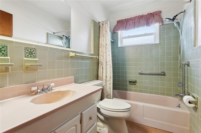 1017 Elmeer Ave, Metairie, LA 70005 - full bath with tile walls, shower / bath combination with curtain, vanity, and toilet