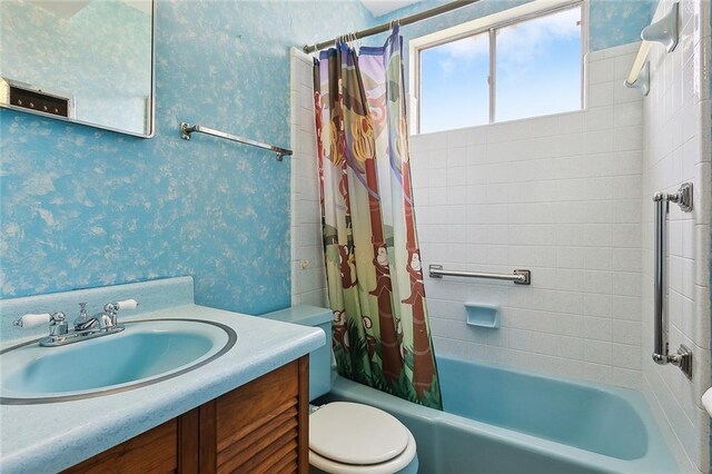 1017 Elmeer Ave, Metairie, LA 70005 - full bath featuring toilet, shower / bathtub combination with curtain, wallpapered walls, and vanity