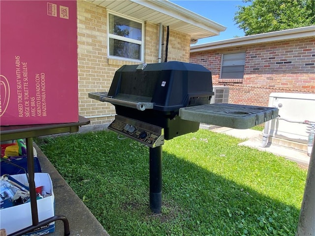 exterior details with a wood stove and brick siding