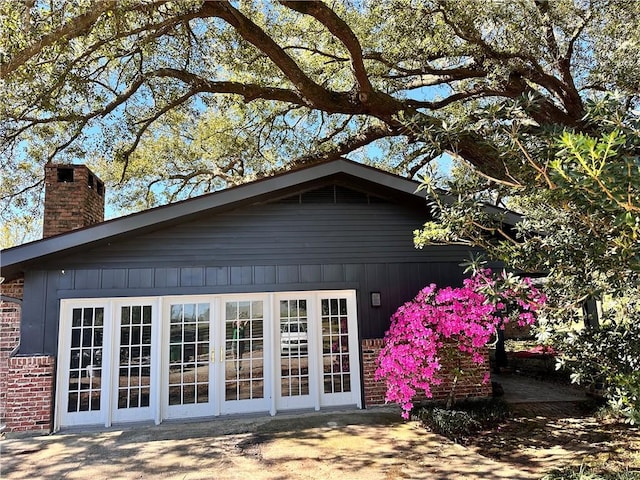130 N Oak Ct, Luling, LA 70070 - rear view of house featuring a chimney and brick siding