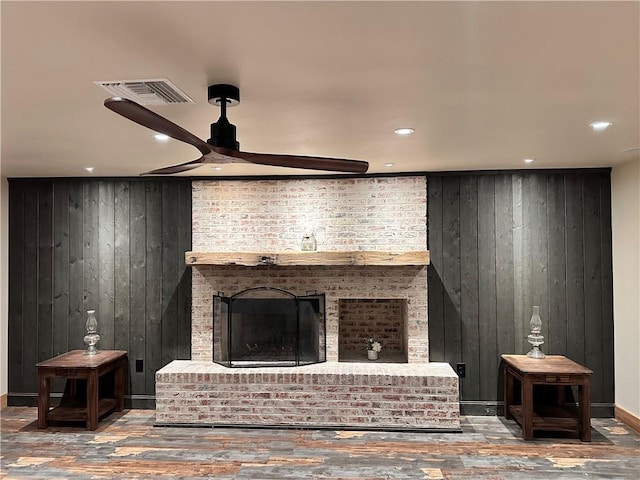 130 N Oak Ct, Luling, LA 70070 - living area featuring wooden walls, wood-type flooring, a ceiling fan, recessed lighting, and a fireplace