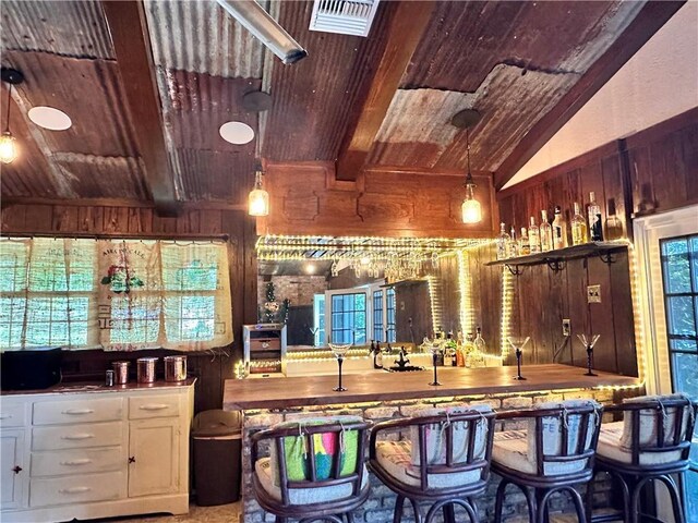 130 N Oak Ct, Luling, LA 70070 - indoor wet bar with wood ceiling, wood walls, and pendant lighting