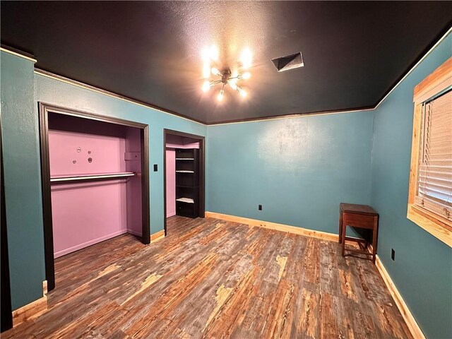 130 N Oak Ct, Luling, LA 70070 - unfurnished bedroom with wood finished floors and baseboards