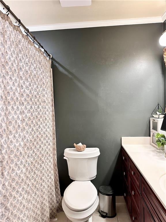 130 N Oak Ct, Luling, LA 70070 - full bathroom with vanity, a shower with curtain, tile patterned floors, and crown molding