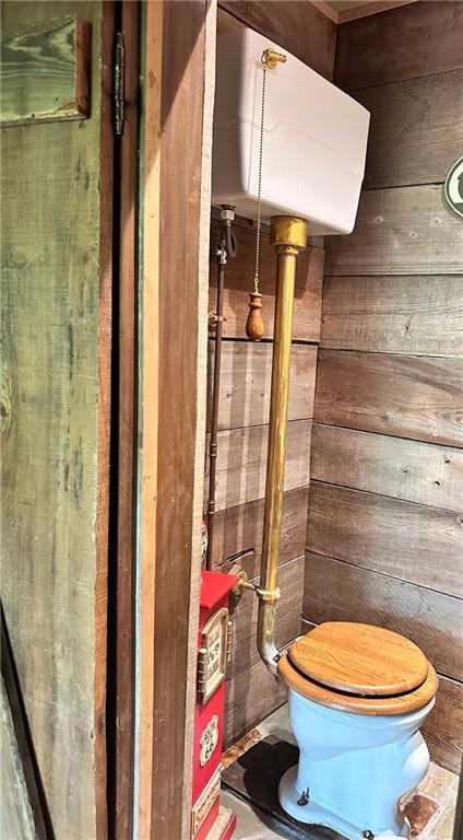 130 N Oak Ct, Luling, LA 70070 - bathroom with toilet and wooden walls
