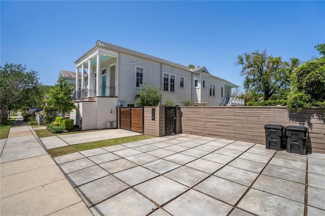 view of patio / terrace featuring fence and a gate