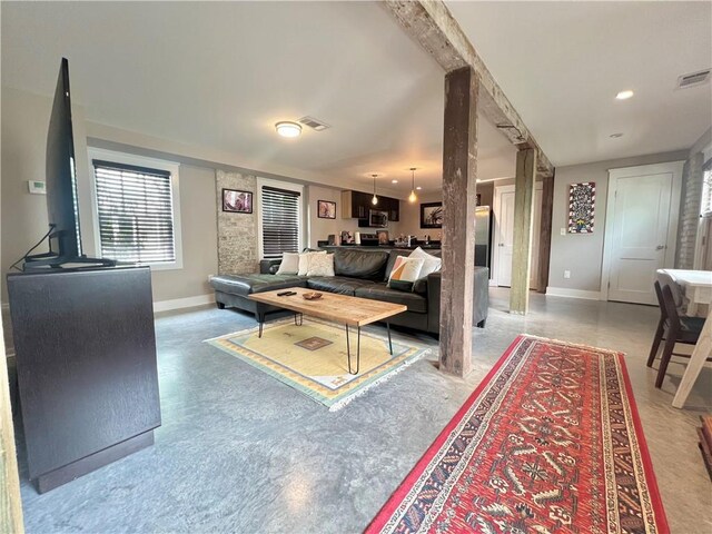 living room featuring visible vents and baseboards