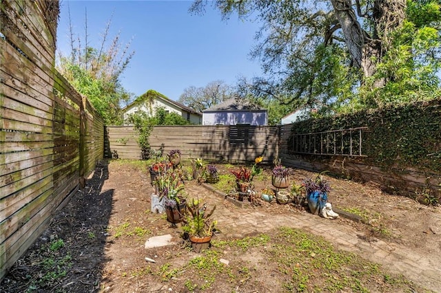 view of yard with a fenced backyard