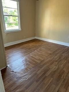 2829 Boyd St, New Orleans, LA 70131 - spare room featuring dark wood-type flooring and baseboards