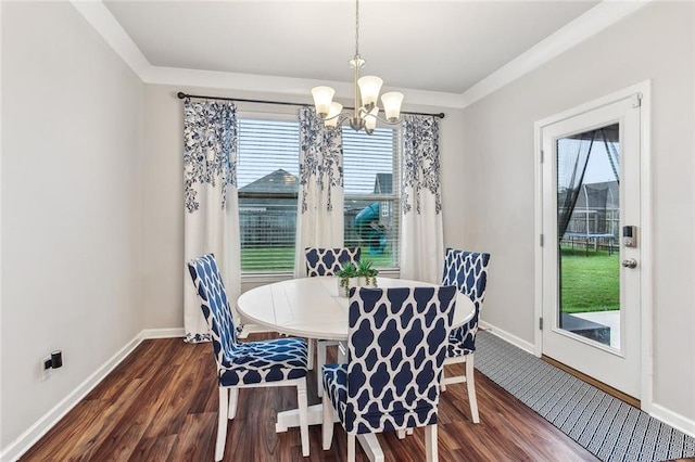 316 Providence Bay Rd, Slidell, LA 70461 - dining area featuring a chandelier, dark wood-type flooring, baseboards, and a healthy amount of sunlight