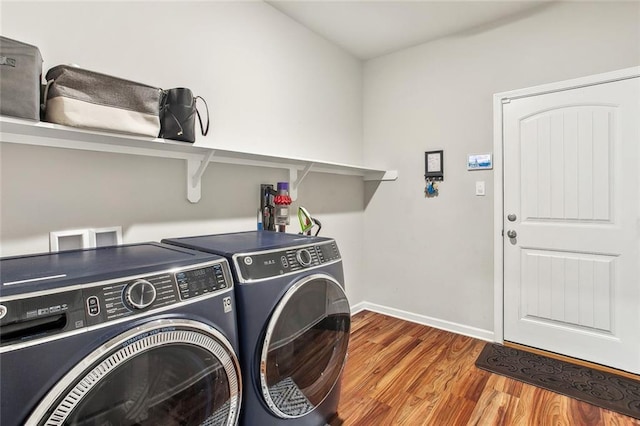 316 Providence Bay Rd, Slidell, LA 70461 - clothes washing area featuring separate washer and dryer, laundry area, baseboards, and wood finished floors