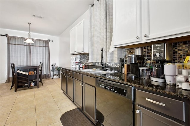 2925 Monica Ln, Marrero, LA 70072 - kitchen with light tile patterned floors, visible vents, dishwasher, a sink, and backsplash