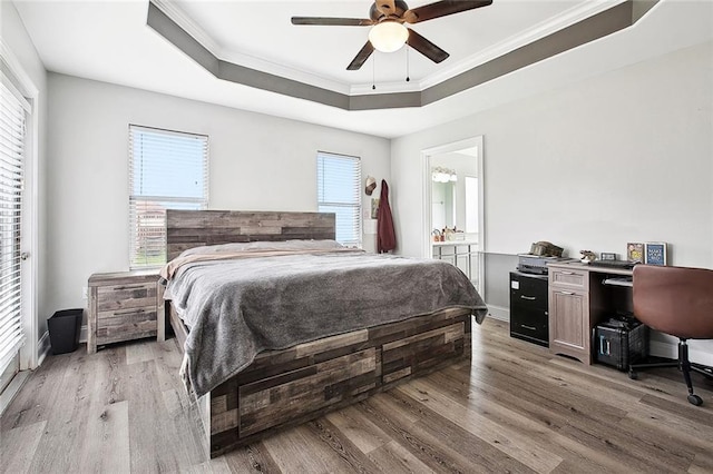 2925 Monica Ln, Marrero, LA 70072 - bedroom with a raised ceiling, crown molding, and light wood-style flooring