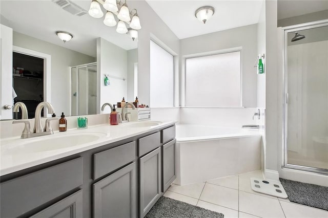 2925 Monica Ln, Marrero, LA 70072 - bathroom featuring tile patterned floors, a garden tub, a shower stall, visible vents, and a sink