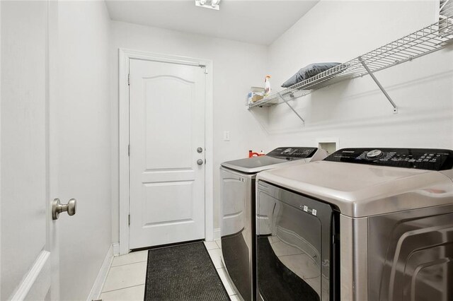 2925 Monica Ln, Marrero, LA 70072 - washroom featuring light tile patterned floors, baseboards, washer and dryer, and laundry area
