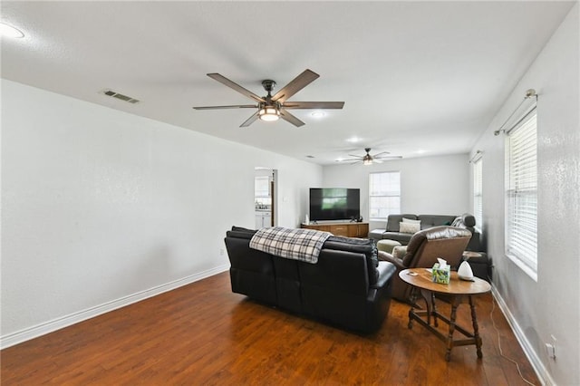 5387 Chamberlain Dr, New Orleans, LA 70122 - living room featuring wood finished floors, baseboards, a ceiling fan, and visible vents