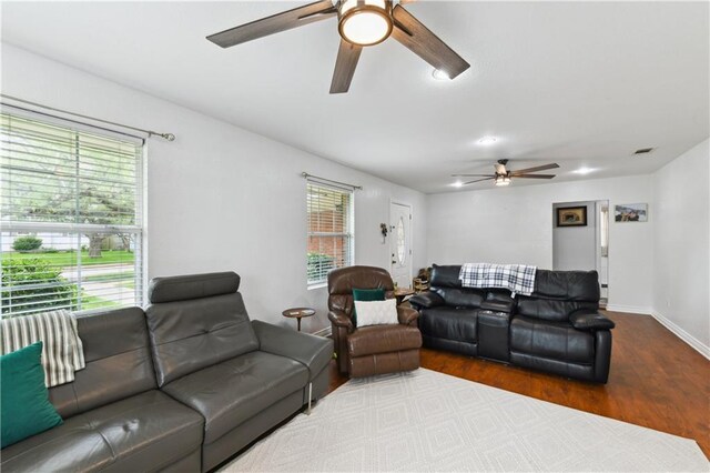 5387 Chamberlain Dr, New Orleans, LA 70122 - living area featuring visible vents, baseboards, a ceiling fan, and wood finished floors