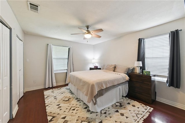 5387 Chamberlain Dr, New Orleans, LA 70122 - bedroom featuring wood finished floors, multiple windows, and visible vents