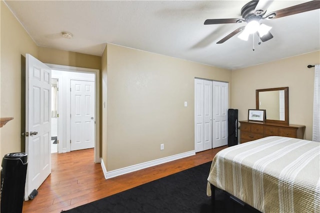 5387 Chamberlain Dr, New Orleans, LA 70122 - bedroom with wood finished floors, ceiling fan, baseboards, and a closet