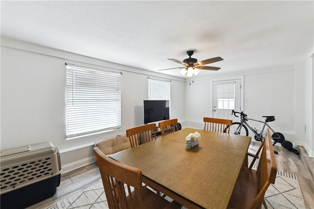 5387 Chamberlain Dr, New Orleans, LA 70122 - dining area featuring ceiling fan, light wood finished floors, and baseboards