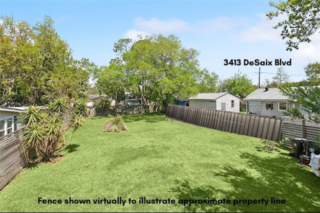 view of yard featuring a fenced backyard