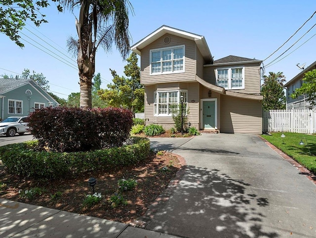 traditional home with fence and driveway