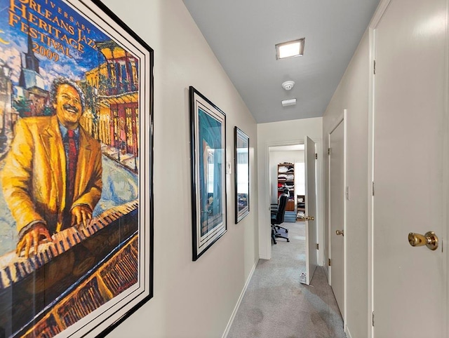 hall with carpet flooring and baseboards