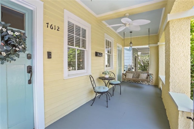 view of patio featuring ceiling fan and covered porch