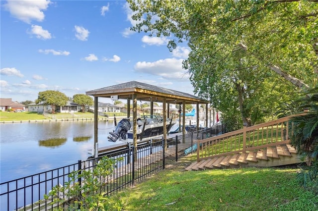 view of dock with a lawn, a water view, and fence