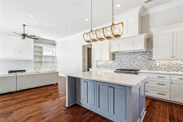 892 Chretien Point Ave, Covington, LA 70433 - kitchen with ornamental molding, a center island, light countertops, white cabinets, and recessed lighting