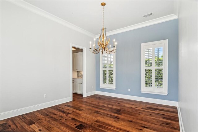 892 Chretien Point Ave, Covington, LA 70433 - empty room with a chandelier, ornamental molding, and dark wood-type flooring