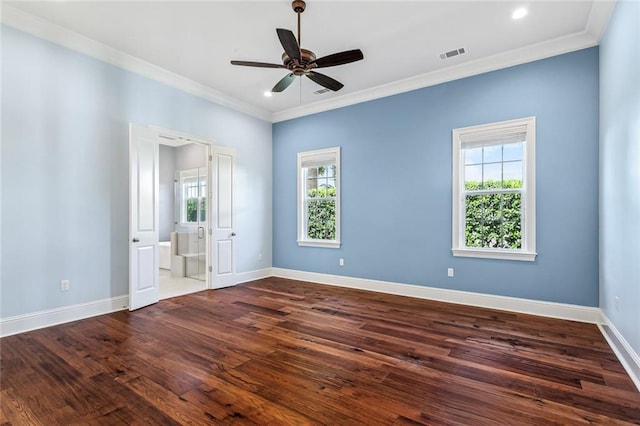892 Chretien Point Ave, Covington, LA 70433 - spare room with healthy amount of natural light, ornamental molding, dark wood-style floors, a ceiling fan, and baseboards
