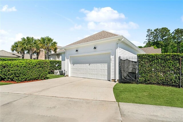 892 Chretien Point Ave, Covington, LA 70433 - view of property exterior featuring a garage and driveway
