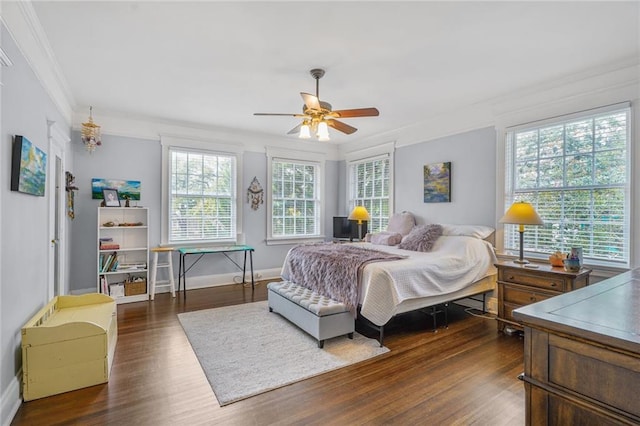 58 Fontainebleau Dr, New Orleans, LA 70125 - bedroom with crown molding, baseboards, dark wood-style flooring, and ceiling fan