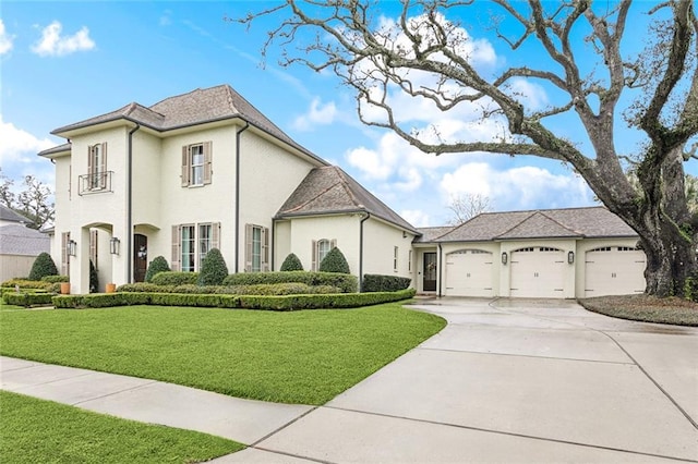 316 Sena Dr, Metairie, LA 70005 - french provincial home with a garage, driveway, and a front yard