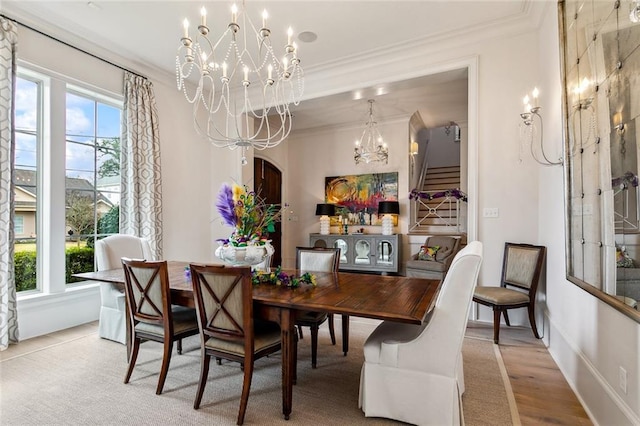 316 Sena Dr, Metairie, LA 70005 - dining area featuring stairway, wood finished floors, an inviting chandelier, baseboards, and ornamental molding