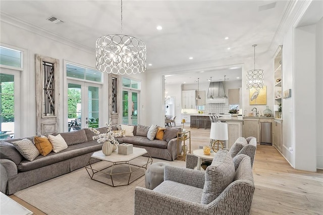 316 Sena Dr, Metairie, LA 70005 - living area featuring a wealth of natural light, light wood-style floors, visible vents, and recessed lighting