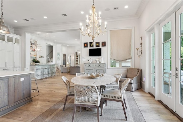 316 Sena Dr, Metairie, LA 70005 - dining room with visible vents, a chandelier, and crown molding