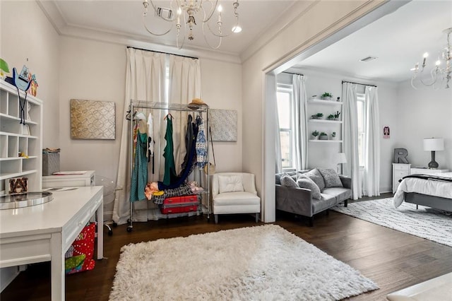 316 Sena Dr, Metairie, LA 70005 - bedroom featuring an inviting chandelier, ornamental molding, dark wood-type flooring, and visible vents