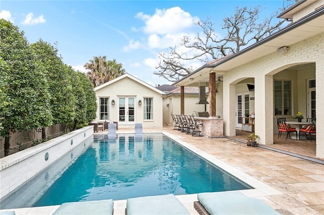 316 Sena Dr, Metairie, LA 70005 - view of pool featuring french doors, a storage structure, outdoor dry bar, a patio area, and an outdoor structure