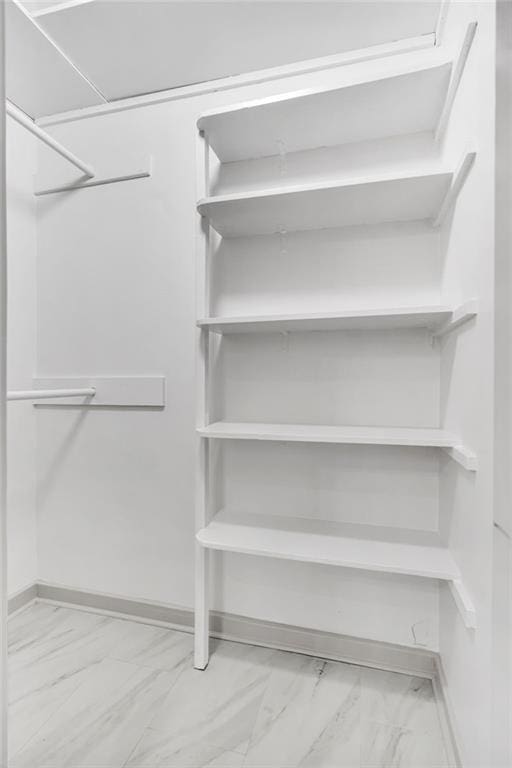818 Bourbon St Unit 1B, New Orleans, LA 70116 - spacious closet featuring marble finish flooring
