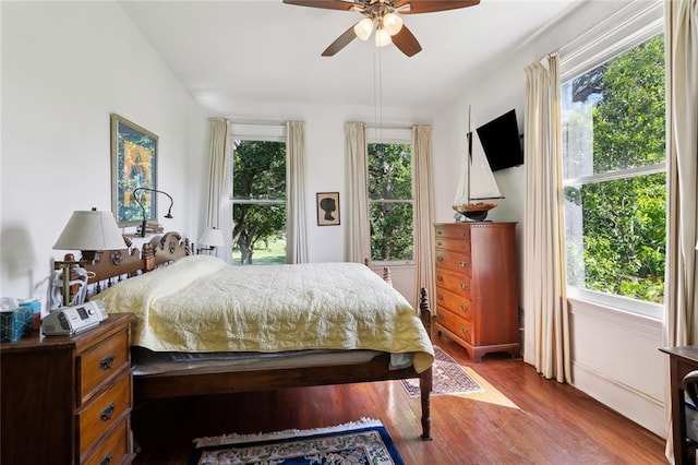 bedroom with ceiling fan and wood finished floors