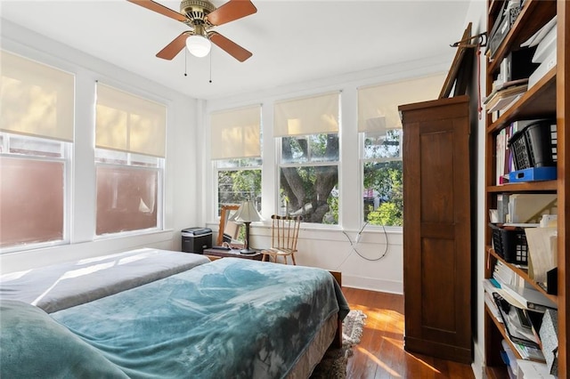 bedroom with dark wood-type flooring