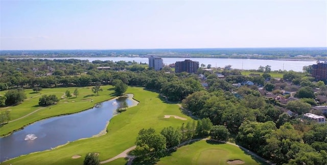birds eye view of property with a water view and golf course view